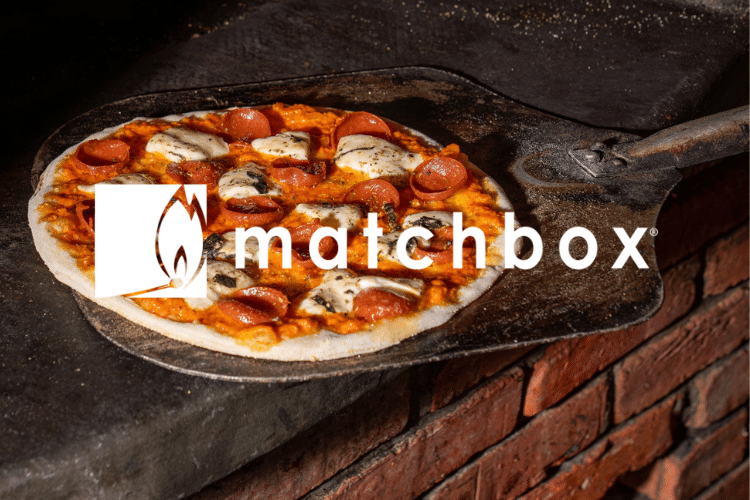 Matchbox logo over an image of a pizza on a pizza peel