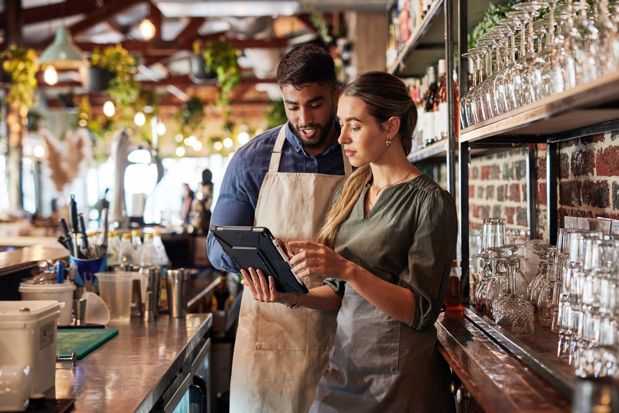 Employees review restaurant inventory management