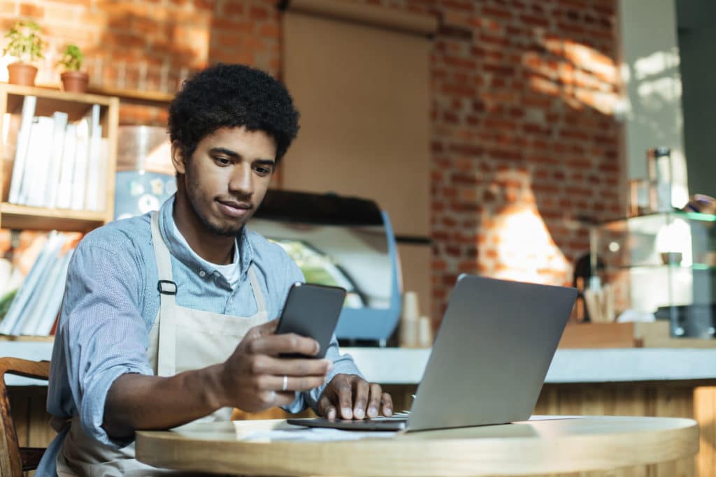 Restaurant Worker Using Tech