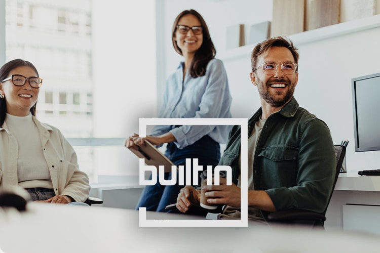 Office workers with BuiltIn logo